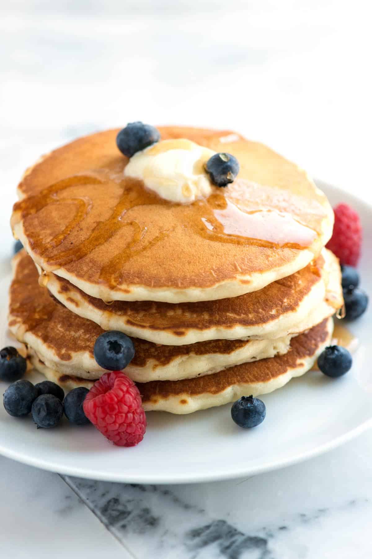 Stack of fluffy pancakes with berries