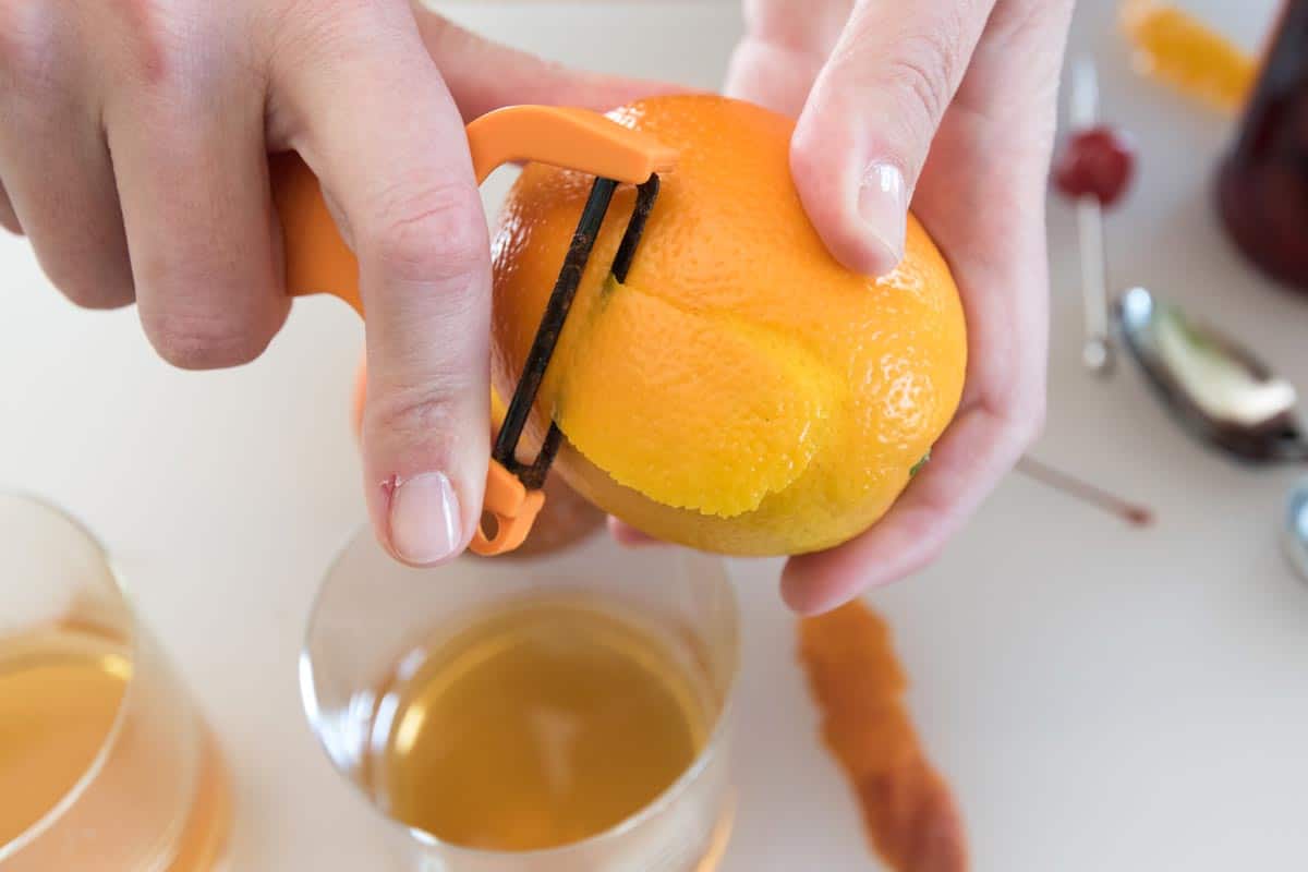 Peeling an orange for an old fashioned