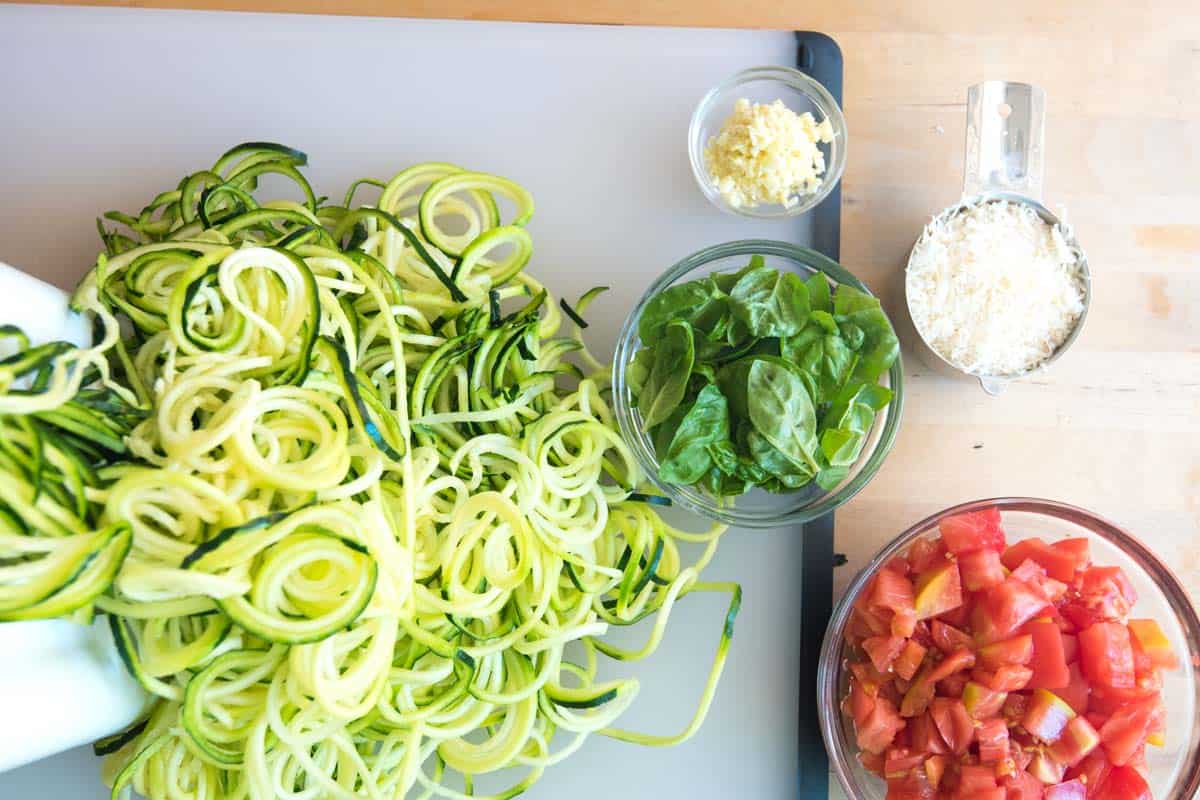 Fresh zucchini noodles, basil and tomatoes