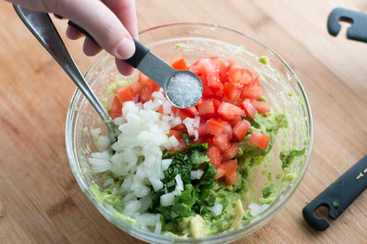 How to make guacamole: adding guacamole ingredients to a bowl