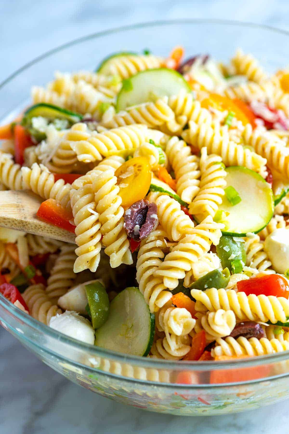 The Best Pasta Salad with fresh veggies, olives, and a homemade dressing.