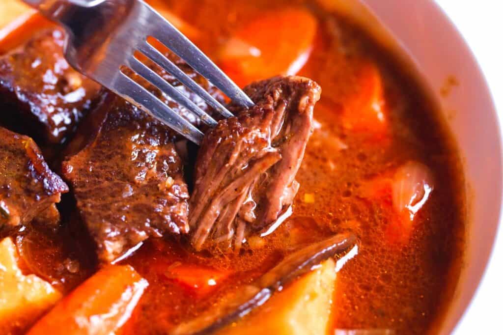 Classic beef stew recipe featuring incredibly tender, melt-in-your-mouth beef