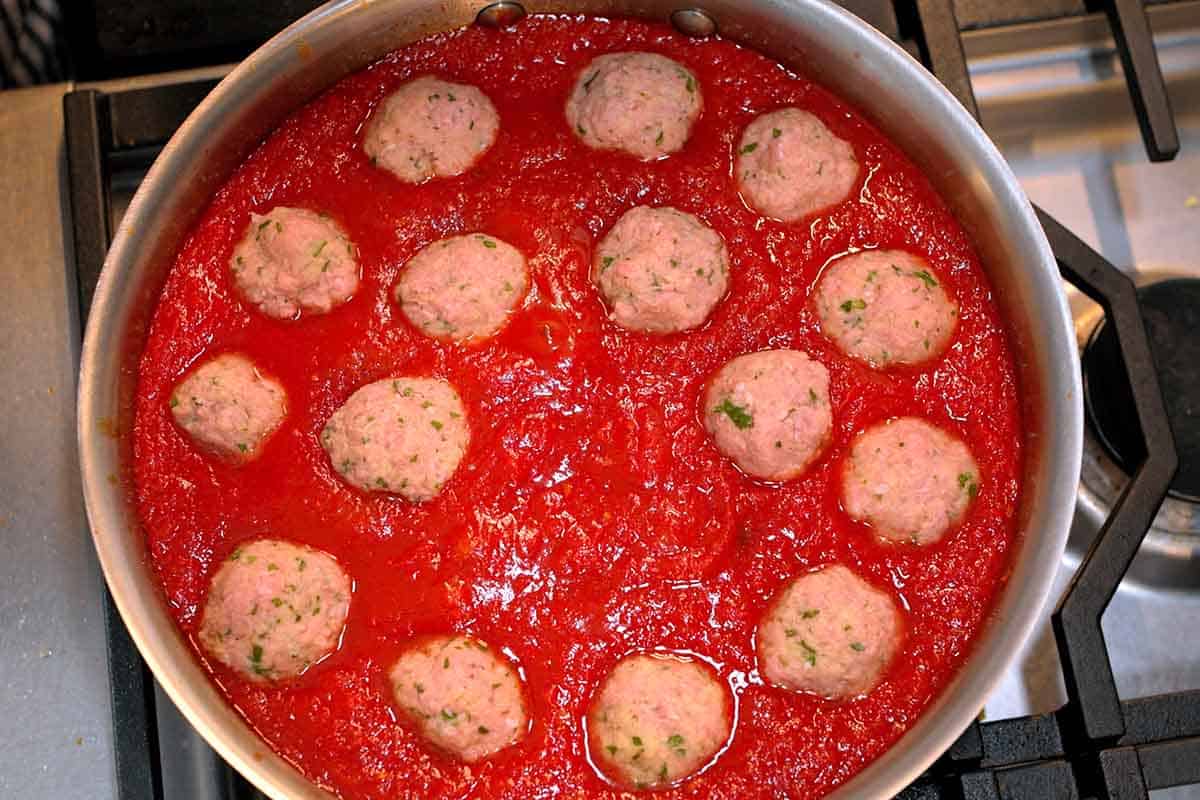 Cooking turkey meatballs in tomato basil sauce