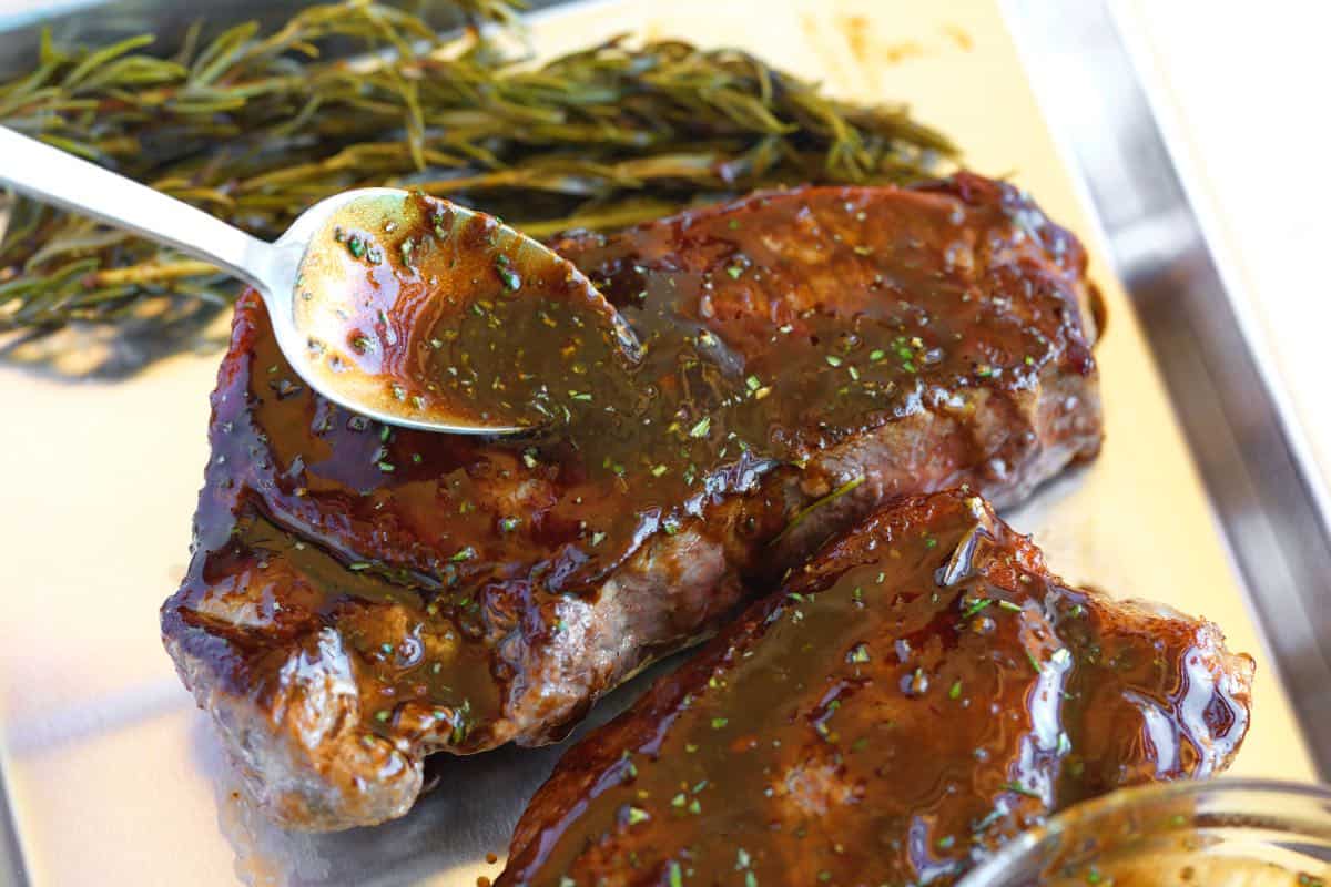 How to Make Steak Salad: Spooning the reverse marinade over cooked steak