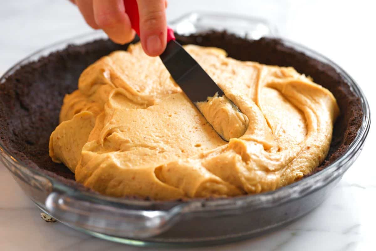 How to Make Peanut Butter Pie: Spreading pie filling in the cookie crust