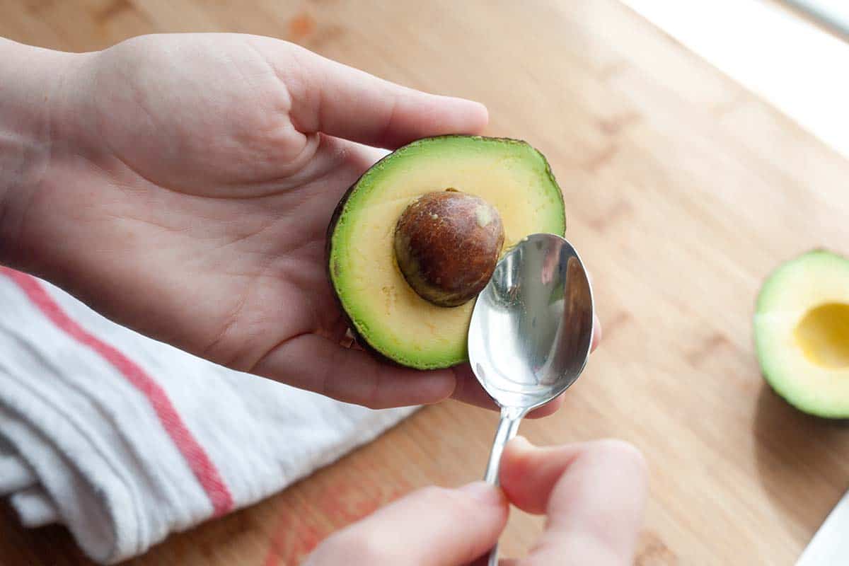 How to Cut an Avocado: Removing the seed with a spoon