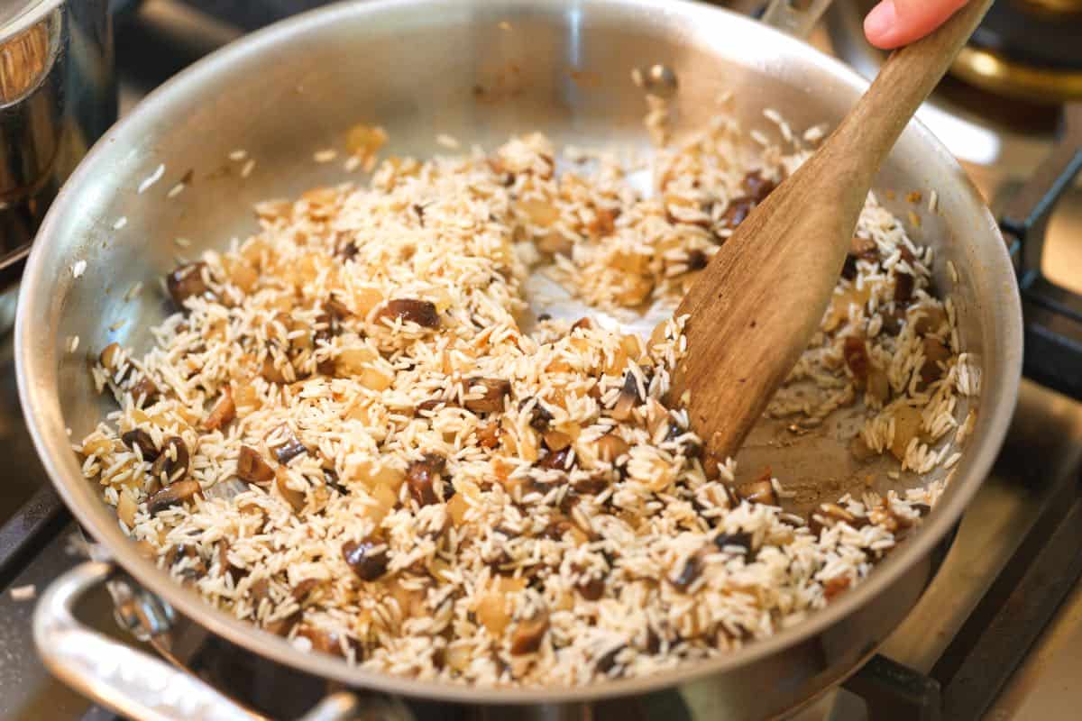 How to Make Chicken and Rice: Toasting the rice before adding broth and the chicken.